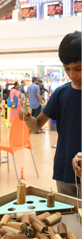 In frames — boy testing a pulley build at RPL Finals